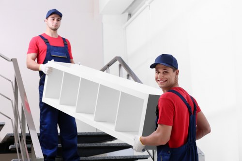Mover wearing PPE while handling household items