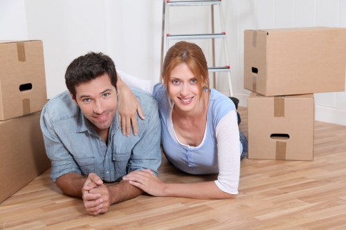 Professional helper carrying furniture during a Camberwell move