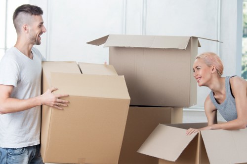 Moving van and packed boxes during house removals in Camberwell