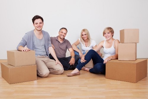 Careful packing and wrapping of household belongings for moving